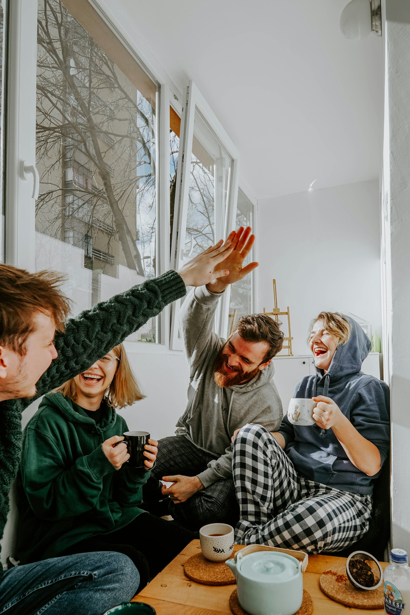 Friends gathering around an outdoor table